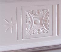 carved detail in fireplace